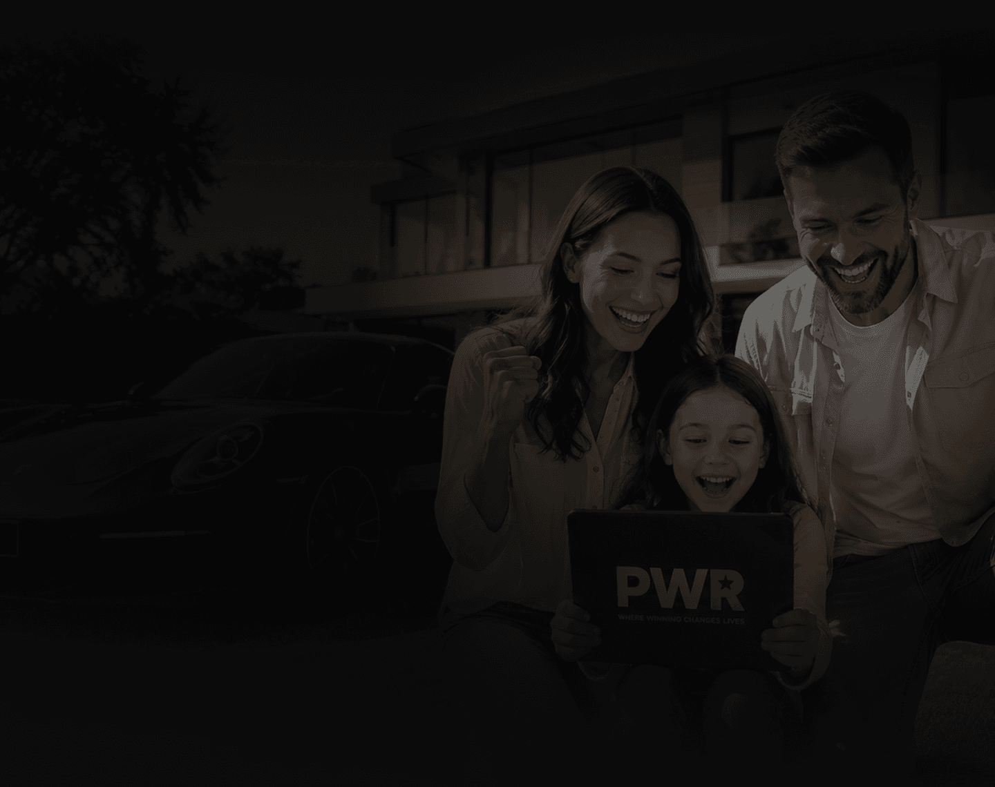 A family celebrating their PWR win